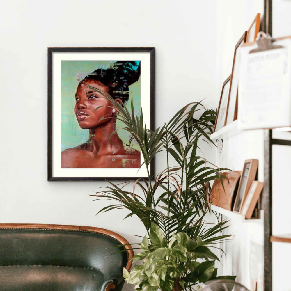 Image shows the artwork, Shine Bright, framed on wall by some plants